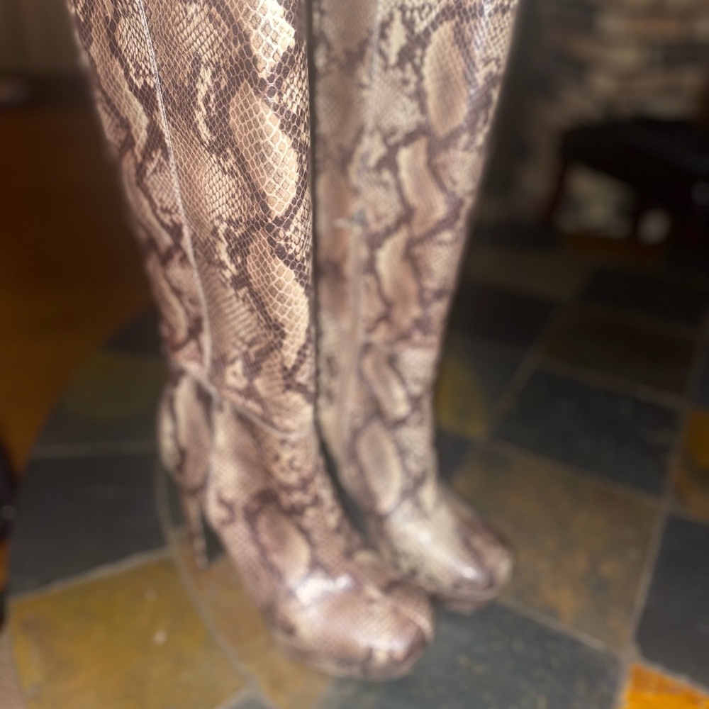 Tall platform snakelike boots